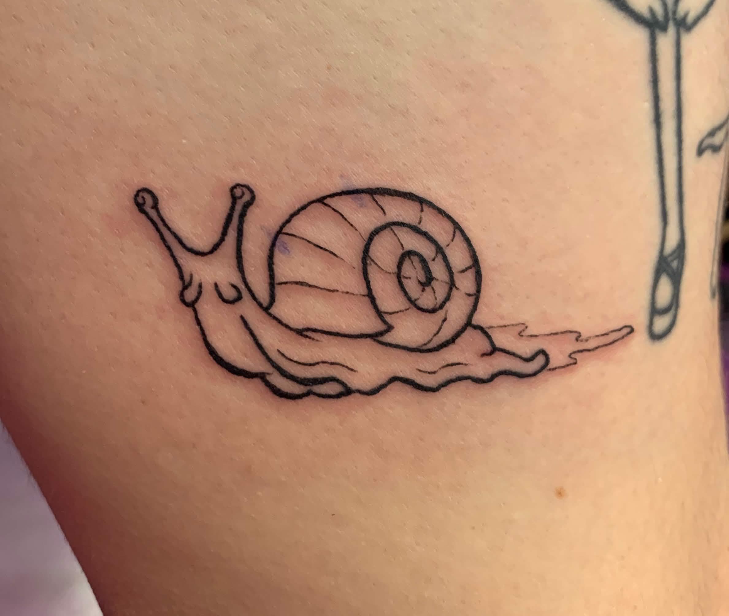 tattoo of a little snail